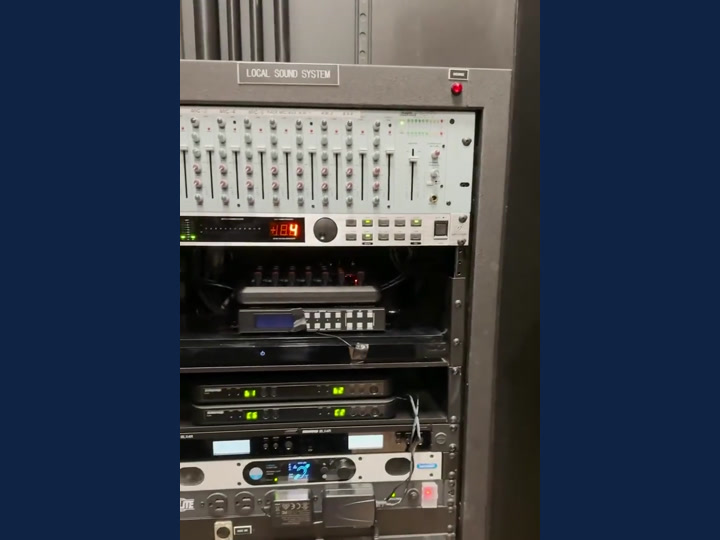 Full-height audio rack showing the mixer, receivers and amplifiers.